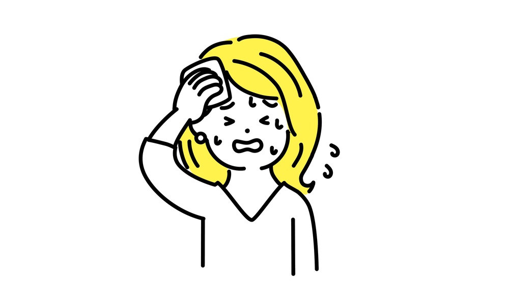 暑さを感じる女性